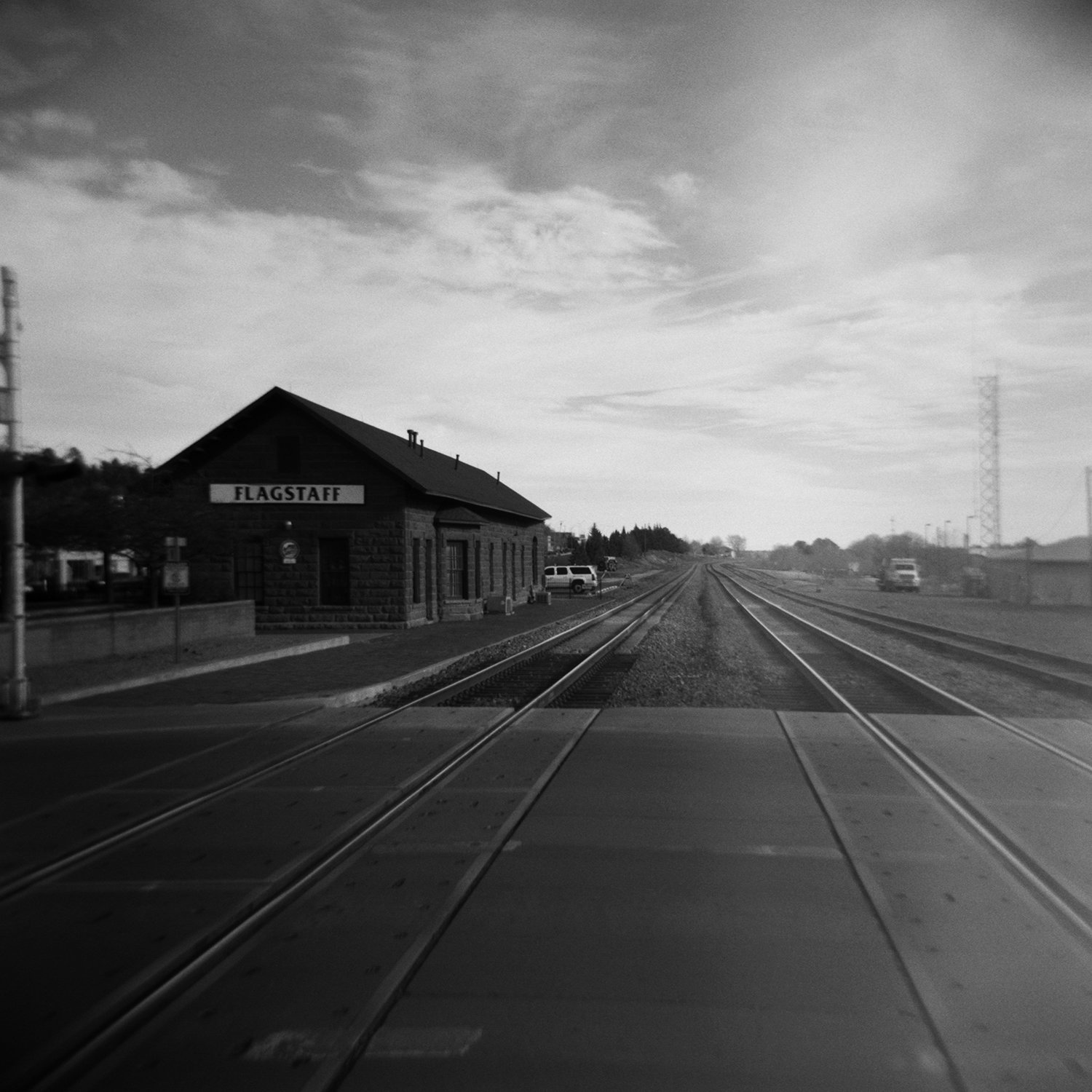 Where is Home? (Northern Arizona University: Railroad Crossing at San Francisco Street / Rest in Peace Ryan Reid) by Aaron Wilder
